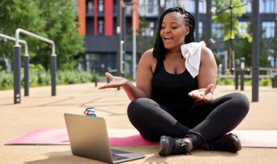 Smiling,Young,Overweight,African,Woman,Talking,With,Personal,Trainer,Instructor